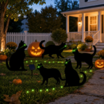 Black cat solar Halloween decorations arranged along a front walkway