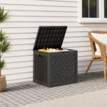 Outdoor storage box used on a tidy patio beside simple outdoor furniture